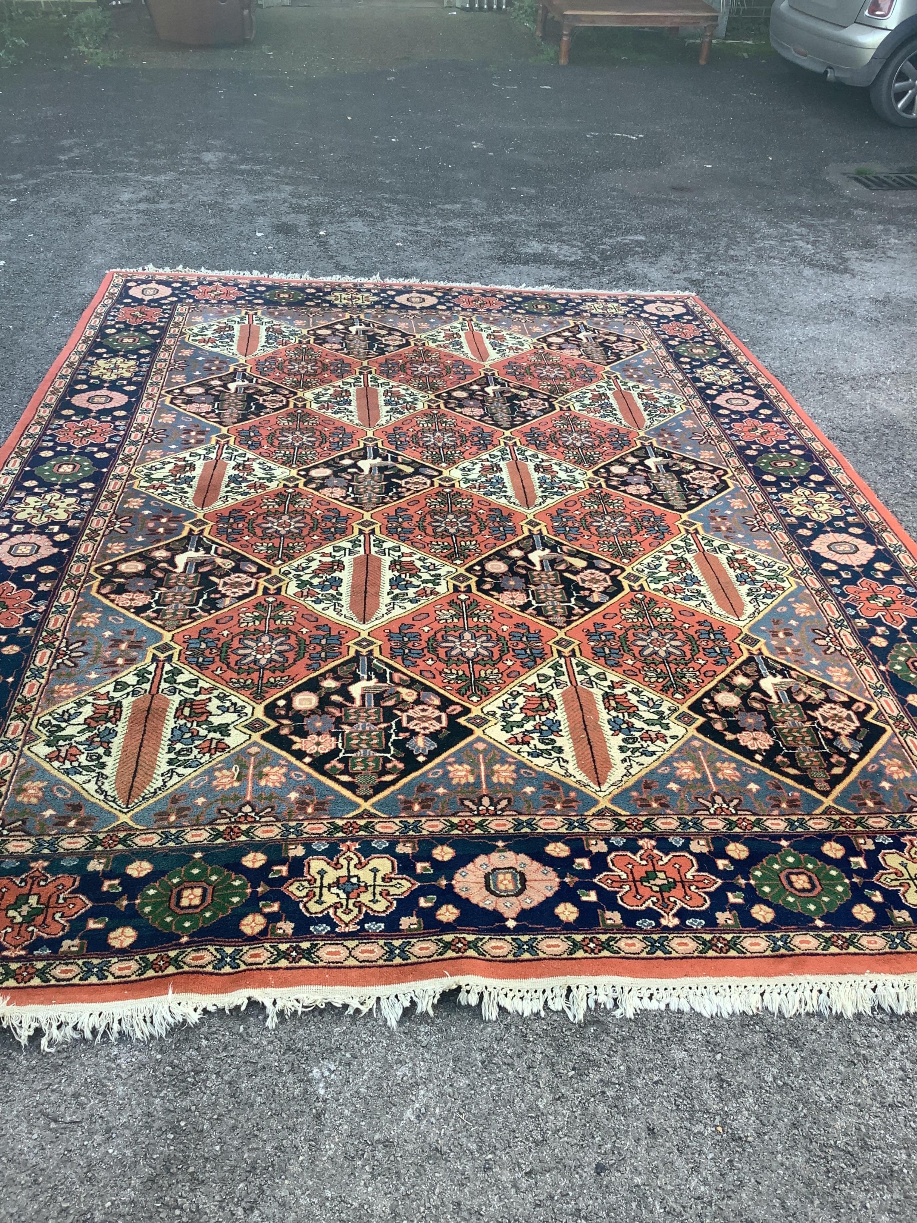 A Caucasian style brick red ground carpet, approximately 350cm x 150cm condition fair.